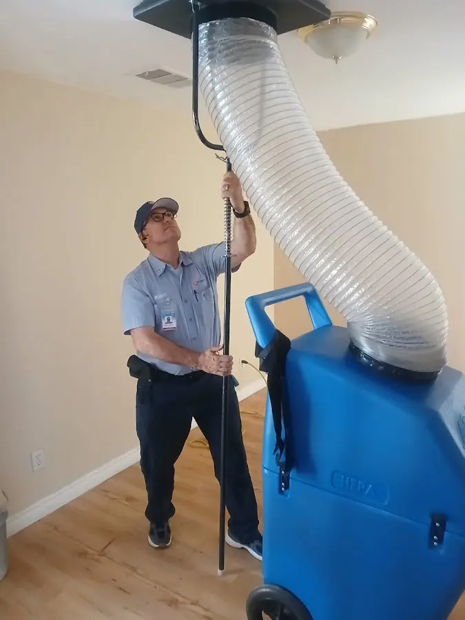 Furnace Tune-Up technician using HEPA equipment in Canyon